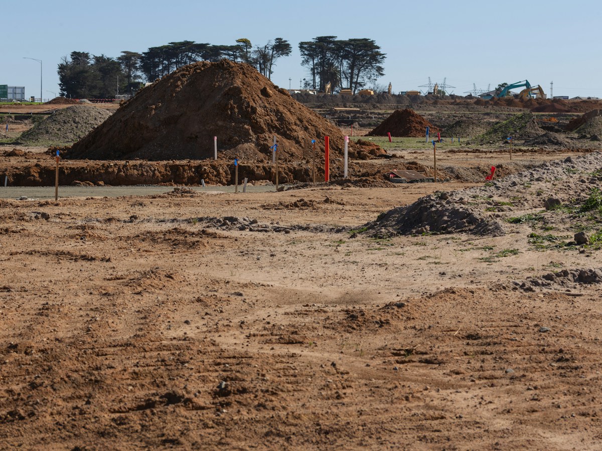 A cleared and graded building pad ready for foundation work